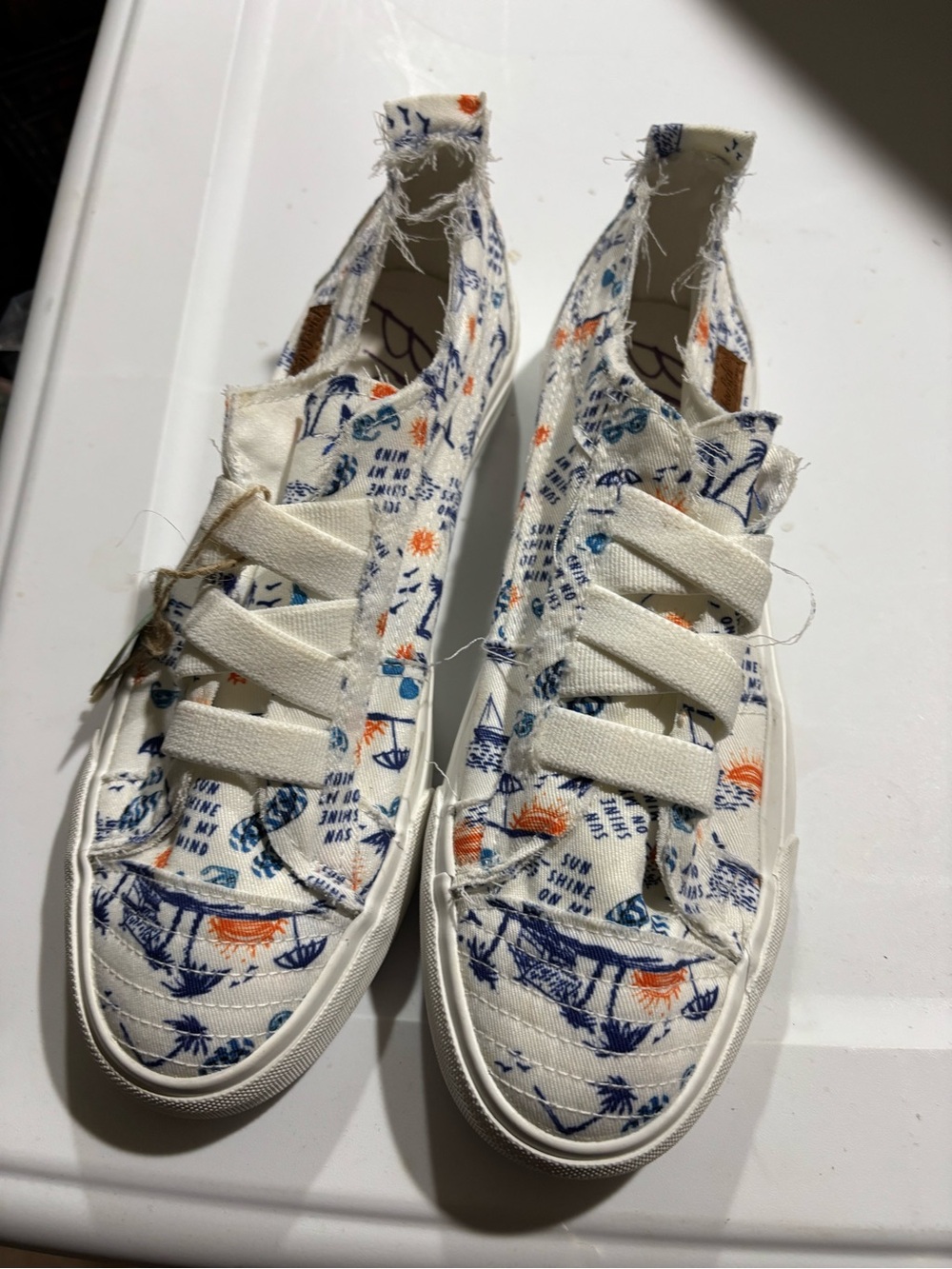 Women’s White Canvas Slip-On Sneakers with Blue & Orange Print